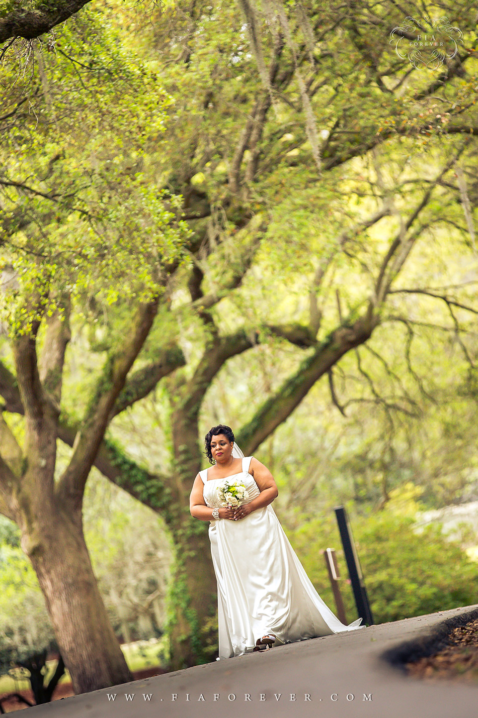 Bride Walking to Ceremony at Legare Waring House, Charleston, SC. Photograph by Charleston Wedding Photographer Fia Forever.