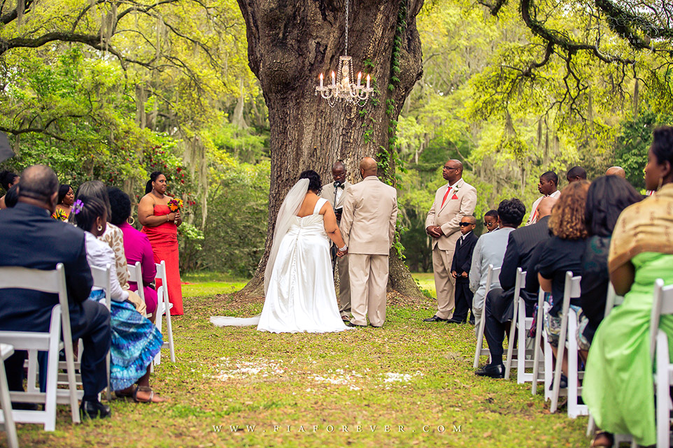 Wedding under Oak Tree at Legare Waring House, Charleston, SC. Photograph by Charleston Wedding Photographer Fia Forever.