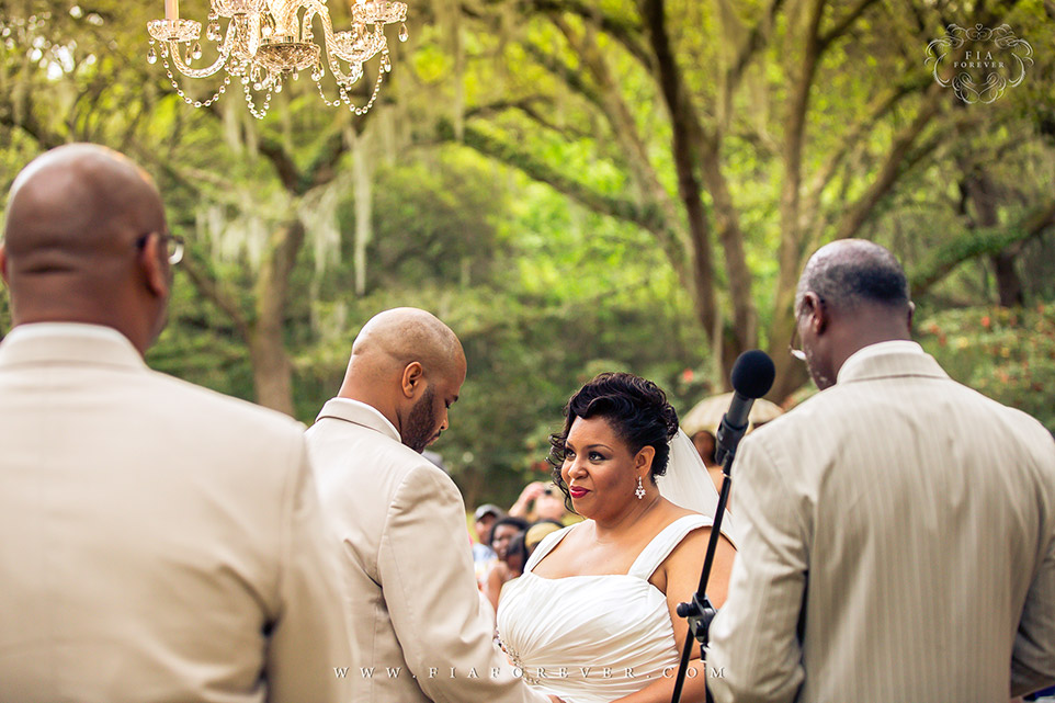 Wedding under Oak Tree Chandelier at Legare Waring House, Charleston, SC. Photo by Wedding Photographer in Charleston, Fia Forever.