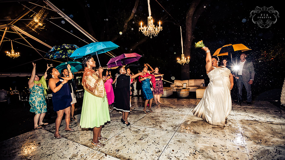 Bouquet Toss on dance floor at Legare Waring House, Charleston, SC. Photograph by Charleston Wedding Photographer Fia Forever.