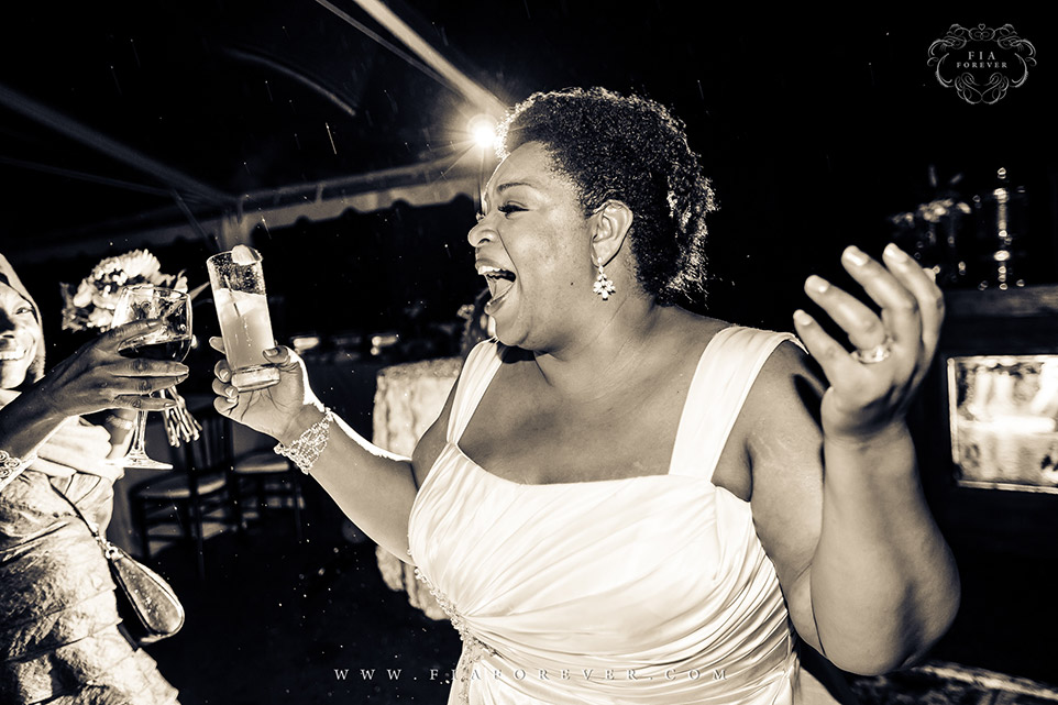 Bride having a great time on dance floor at Legare Waring House, Charleston, SC. Photo by Wedding Photographer in Charleston, Fia Forever.