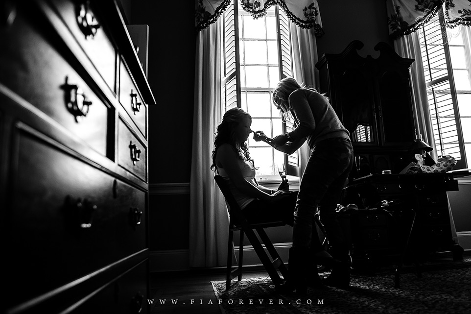 Silhuette Shot of Manda getting ready for her wedding at Lowndes Grove Plantation Lavender Room Photo by Wedding Photographers in Charleston Fia Forever