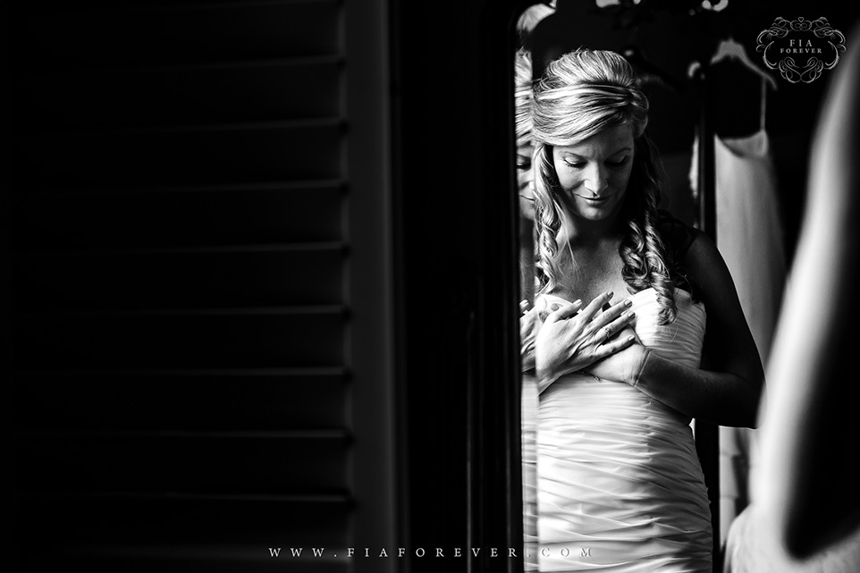 Bride putting on her dress Lowndes Grove Plantation Wedding Lavender Room Photo by Wedding Photographers in Charleston Fia Forever