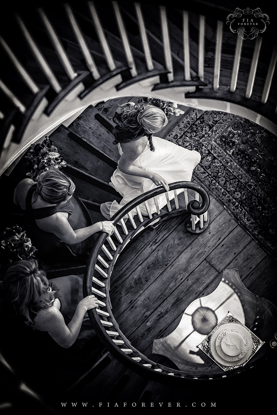 Bride and bridesmaids on staircase Lowndes Grove Plantation Wedding Lavender Room Photo by Charleston Wedding Photographers Fia Forever