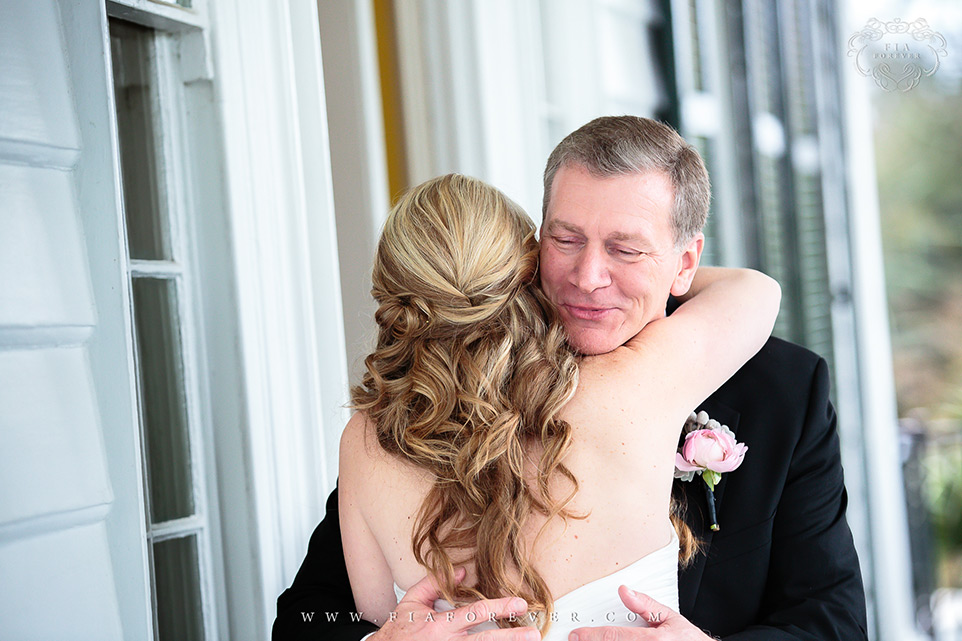 Dad hugging bride after first look Lowndes Grove Plantation WeddingPhoto by Charleston Wedding Photographers Fia Forever