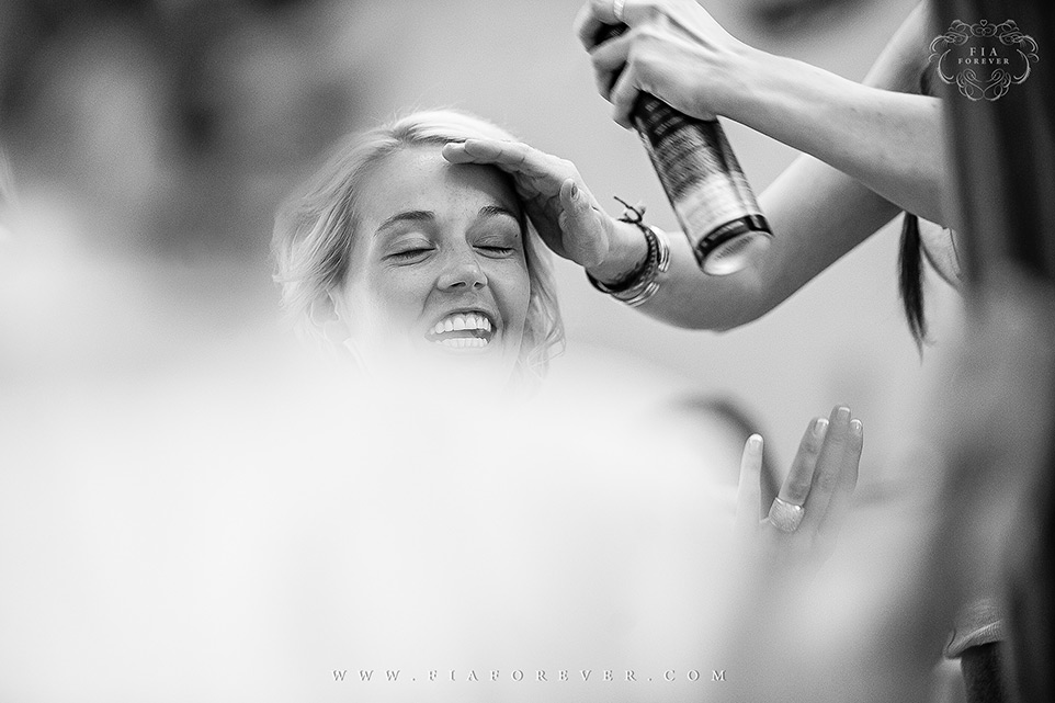 Bride-getting-hair-done-before-getting-into-her-dress-photo-by-wedding-photographers-charleston-sc-Fia-Forever