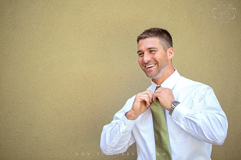 Groom-putting-on-his-tie-photo-by-wedding-photographers-charleston-sc-Fia-Forever