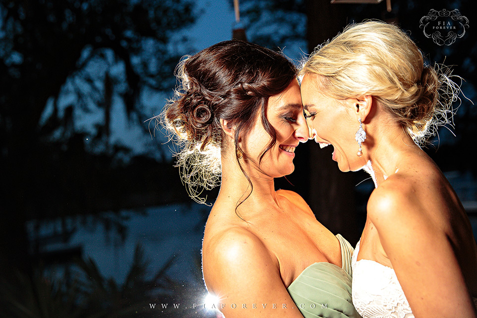Bride-and-Bridesmaid-Portraits-at-Sunset-in-Charleston-SC-photo-by-wedding-photographers-charleston-sc-Fia-Forever